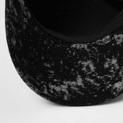 Black paint splatter badge cap